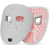 White LED face mask with visible red light panels on a white background