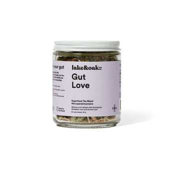 Jar of 'Gut Love' tea blend with a purple label on a white background